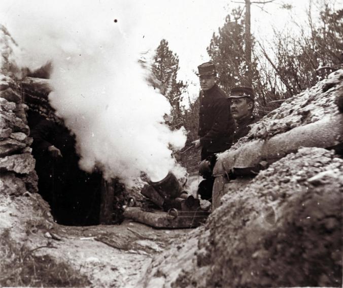 An undated archive picture shows French soldiers firing a 155 mm mortar from a trench on the front line, at an unknown location in France. (REUTERS/Collection Odette Carrez) 