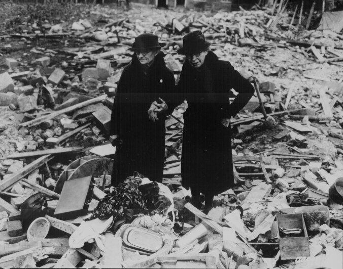 ww2Two bewildered old ladies stand amid the levelled ruins of the almshouse which was HomeAlmshouse bombed  10 Newbury   Photograph taken 11th February