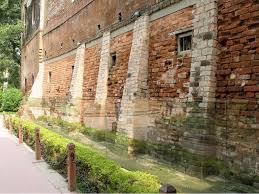 Bullet marks, visible on preserved walls, at present-day Jallianwala Bagh [Wikipedia]